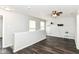 Open loft area with neutral paint and hardwood flooring at 9676 W Constellation Dr, Pendleton, IN 46064