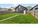 A fenced in backyard with a small stone path at 1016 Churchman Ave, Indianapolis, IN 46203