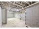 Unfinished basement with painted walls, exposed piping, and a concrete floor at 1016 Churchman Ave, Indianapolis, IN 46203
