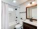 Bathroom featuring black fixtures, subway tile surround and decorative niche at 1016 Churchman Ave, Indianapolis, IN 46203