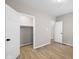 Spacious bedroom featuring light hardwood floors, neutral walls, and a closet at 1016 Churchman Ave, Indianapolis, IN 46203