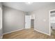 Comfortable bedroom with light hardwood floors, natural light, and a closet at 1016 Churchman Ave, Indianapolis, IN 46203