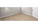 Clean, bright bedroom with hardwood floors and two windows allowing for natural light at 1016 Churchman Ave, Indianapolis, IN 46203