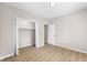 Neutral bedroom with white trim, wood floor, and a bi-fold closet at 1016 Churchman Ave, Indianapolis, IN 46203