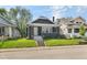 Charming home with a well-manicured lawn, gray siding, inviting front porch, and steps at 1016 Churchman Ave, Indianapolis, IN 46203