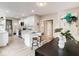 Bright, modern kitchen with white cabinets, an island, and stainless steel appliances and quartz countertops at 1016 Churchman Ave, Indianapolis, IN 46203