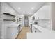 Renovated kitchen with stainless steel appliances, white cabinetry, and subway tile backsplash at 1016 Churchman Ave, Indianapolis, IN 46203
