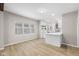 Bright, open-concept living room and kitchen featuring modern lighting and neutral paint at 1016 Churchman Ave, Indianapolis, IN 46203