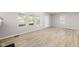 Spacious living room with natural light, and light wood floors providing a bright and airy feel at 1016 Churchman Ave, Indianapolis, IN 46203