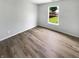 Cozy bedroom featuring a window with views of a green lawn at 10366 Camby Xing, Fishers, IN 46038