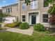 Beautiful home exterior with a well-manicured lawn, brick accents, and mature landscaping at 10366 Camby Xing, Fishers, IN 46038