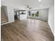 Spacious living room featuring new floors, recessed lighting, and a ceiling fan at 10366 Camby Xing, Fishers, IN 46038