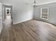 Well-lit living room showcasing durable floors and a large window at 10366 Camby Xing, Fishers, IN 46038