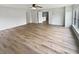 Bright and spacious living room with wood floors, neutral paint, and multiple entryways at 10366 Camby Xing, Fishers, IN 46038