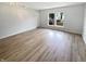 Sunlit living room featuring new flooring and a window offering natural light at 10366 Camby Xing, Fishers, IN 46038
