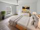 Airy main bedroom with ample natural light, modern decor, and light hardwood flooring at 10366 Camby Xing, Fishers, IN 46038
