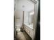 Bright bathroom with white double vanity and toilet at 10447 Pintail Ln, Indianapolis, IN 46239