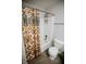 A bathroom featuring a shower and toilet at 10447 Pintail Ln, Indianapolis, IN 46239