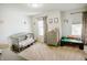 Charming bedroom with gray crib, dresser and natural light through two windows at 10447 Pintail Ln, Indianapolis, IN 46239