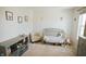 Cozy Bedroom features a gray crib, patterned chair, and cubby organizer at 10447 Pintail Ln, Indianapolis, IN 46239