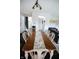 Charming dining room with rustic wooden table, seating for eight, and open access to other living spaces at 10447 Pintail Ln, Indianapolis, IN 46239