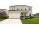 Charming two-story home with a well-manicured front yard, garage and inviting entrance at 10447 Pintail Ln, Indianapolis, IN 46239