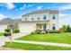 Exterior view of a well maintained two-story home with a manicured lawn and a mailbox out front at 10447 Pintail Ln, Indianapolis, IN 46239