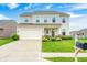 Charming two-story home featuring a well-manicured lawn, attached garage, and welcoming front porch at 10447 Pintail Ln, Indianapolis, IN 46239
