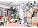 Organized garage space with ample storage, bikes, and a basketball hoop at 10447 Pintail Ln, Indianapolis, IN 46239