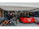 Well-organized garage featuring a red Corvette and ample storage solutions at 10447 Pintail Ln, Indianapolis, IN 46239