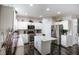 Bright, modern kitchen boasts stainless appliances, white cabinets, and stylish island at 10447 Pintail Ln, Indianapolis, IN 46239