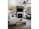 Inviting living room with a fireplace, built-in shelves, and comfortable seating for relaxation and entertainment at 10447 Pintail Ln, Indianapolis, IN 46239