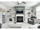 Cozy living room with fireplace, modern shelving, comfortable seating, and bright neutral tones at 10447 Pintail Ln, Indianapolis, IN 46239