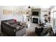 Spacious living room featuring a fireplace, comfortable seating, and ample natural light creating a cozy atmosphere at 10447 Pintail Ln, Indianapolis, IN 46239