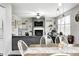 Open-concept living space, blending the dining area with the inviting living room featuring a fireplace at 10447 Pintail Ln, Indianapolis, IN 46239