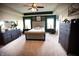 Spacious main bedroom with tray ceiling, accent wall, carpet flooring, and large windows providing plenty of natural light at 10447 Pintail Ln, Indianapolis, IN 46239