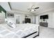 A spacious main bedroom with a ceiling fan, a television, and an ensuite bathroom at 10447 Pintail Ln, Indianapolis, IN 46239
