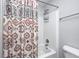 Bathtub and shower combination with shower caddy at 10447 Pintail Ln, Indianapolis, IN 46239