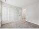 A view of a bedroom with neutral carpeting, a window, and a closet at 1093 Country Meadow Ct, Franklin, IN 46131