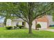 Inviting home exterior featuring lush lawn and mature tree, providing shade and curb appeal at 1093 Country Meadow Ct, Franklin, IN 46131