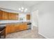 A view of the kitchen with oak cabinets and a granite countertop at 1093 Country Meadow Ct, Franklin, IN 46131