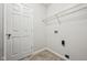 The laundry room features washer/dryer hookups and a wire shelf at 1093 Country Meadow Ct, Franklin, IN 46131