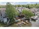 Aerial view of the property, showing the house, deck, lake and boat docks at 11226 Blackwalnut Pt, Indianapolis, IN 46236