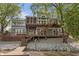 Spacious backyard featuring a multi-level deck, stone accents, and access to the water at 11226 Blackwalnut Pt, Indianapolis, IN 46236