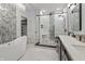 Modern bathroom featuring a freestanding tub, dual vanities, and a glass-enclosed shower at 11226 Blackwalnut Pt, Indianapolis, IN 46236