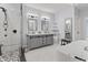 Elegant bathroom showcasing dual sinks, a freestanding tub, and glass-enclosed shower at 11226 Blackwalnut Pt, Indianapolis, IN 46236