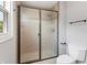 Bathroom with a glass-door shower, neutral tile, and a large toilet at 11226 Blackwalnut Pt, Indianapolis, IN 46236