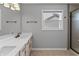 Bathroom features a double sink vanity with great counter space, a shower, and a window at 11226 Blackwalnut Pt, Indianapolis, IN 46236
