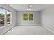 Bright bedroom features light walls, and a large window showing greenery at 11226 Blackwalnut Pt, Indianapolis, IN 46236