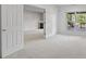 Bright bedroom featuring neutral carpet, a fireplace and window with an outdoor view at 11226 Blackwalnut Pt, Indianapolis, IN 46236